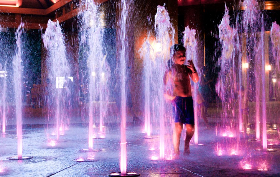 Playing in the Fountain at Night